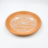 Round burnished clay plate