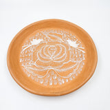 Round burnished clay plate