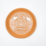 Round burnished clay plate
