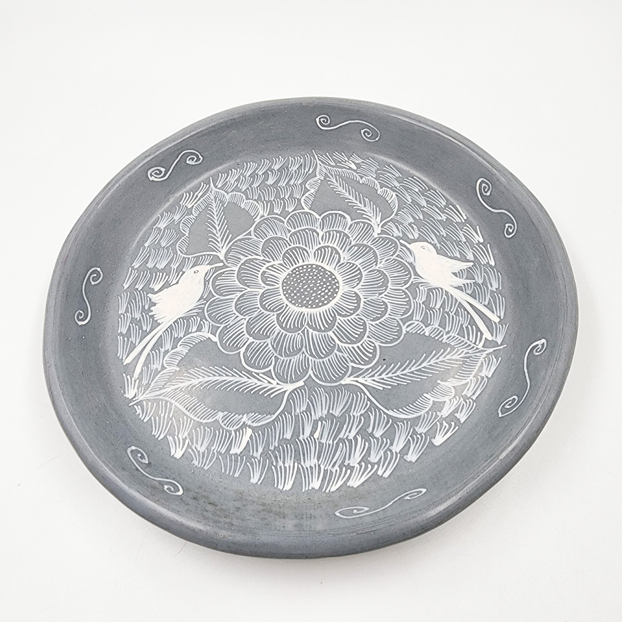 Round burnished clay plate