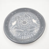 Round burnished clay plate