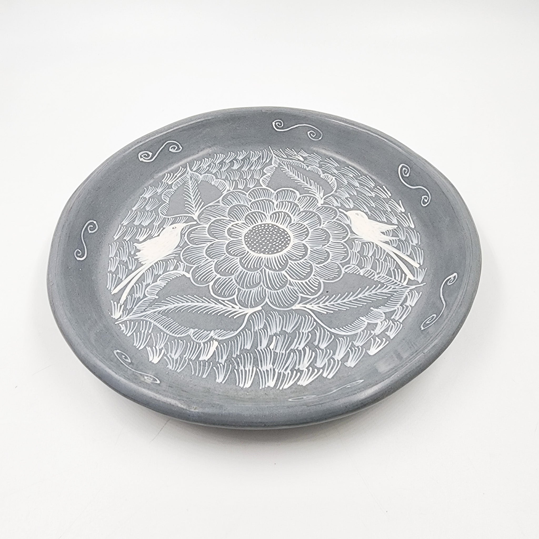Round burnished clay plate