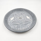 Round burnished clay plate