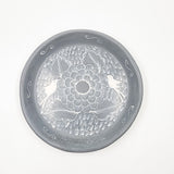 Round burnished clay plate