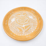 Round burnished clay plate