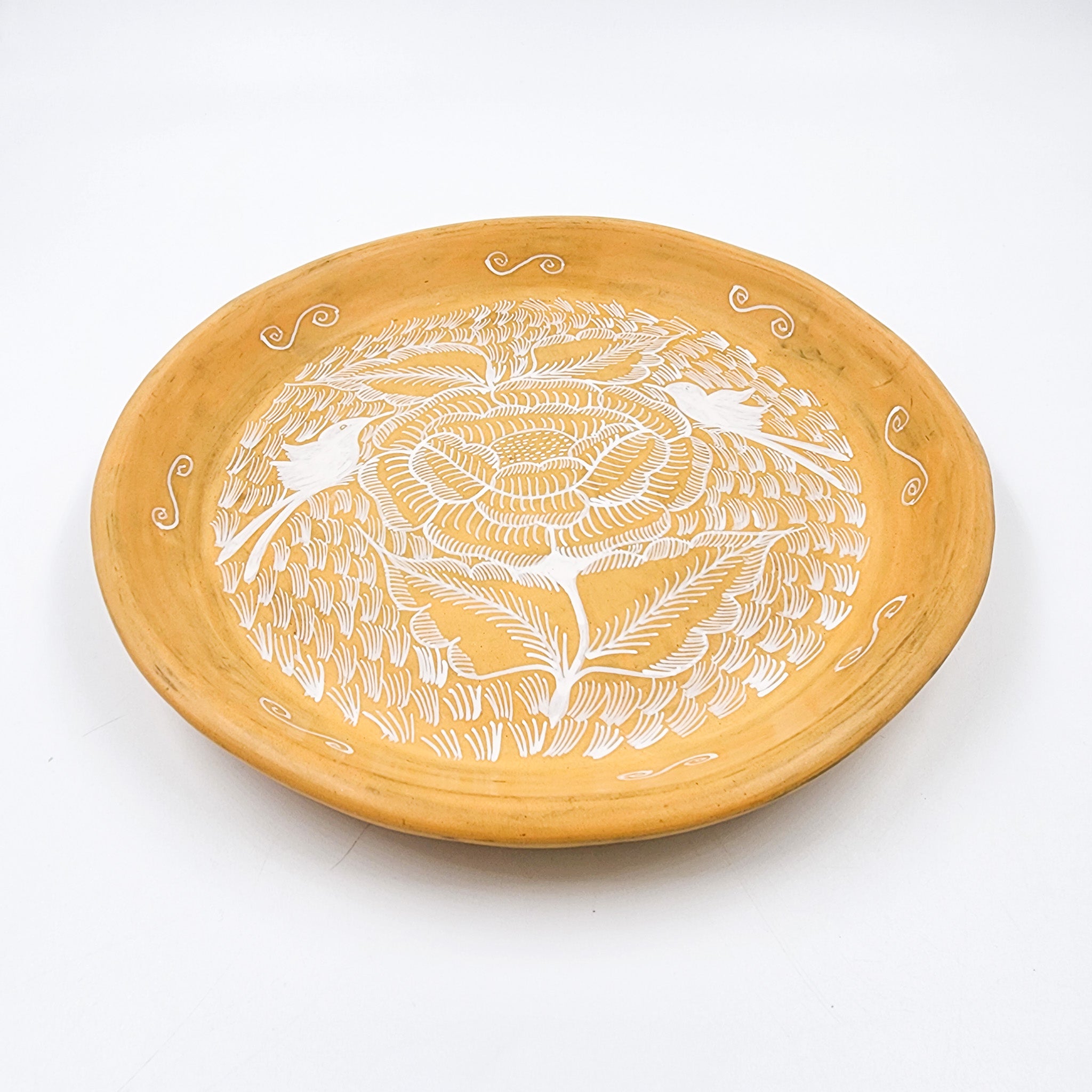 Round burnished clay plate