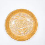 Round burnished clay plate