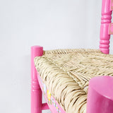 Silla artesanal rosa de madera y palma