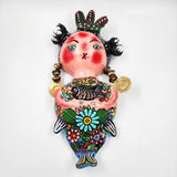 Sirena artesanal hecha de coco