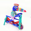 Tucán en bicicleta — Talla de madera alebrije
