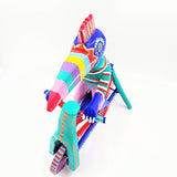 Tucán en bicicleta — Talla de madera alebrije