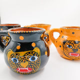 Tazas de barro Jaguar en negro o amarillo
