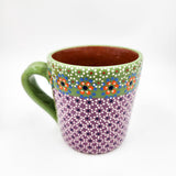 Taza de barro capulineado