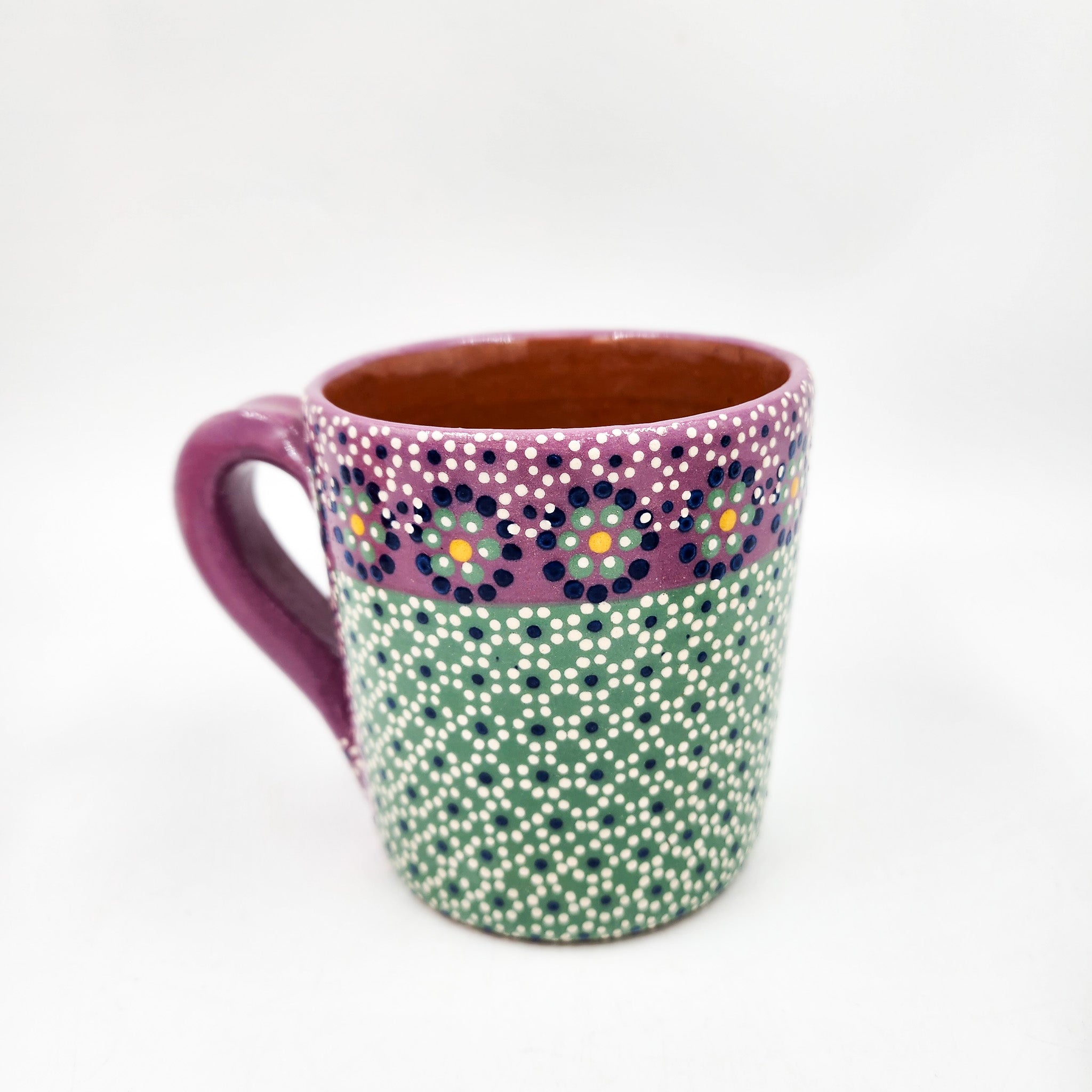 Taza de barro capulineado