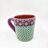 Taza de barro capulineado
