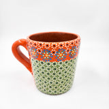 Taza de barro capulineado
