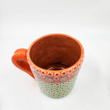 Taza de barro capulineado