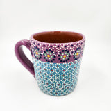 Taza de barro capulineado