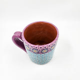 Taza de barro capulineado