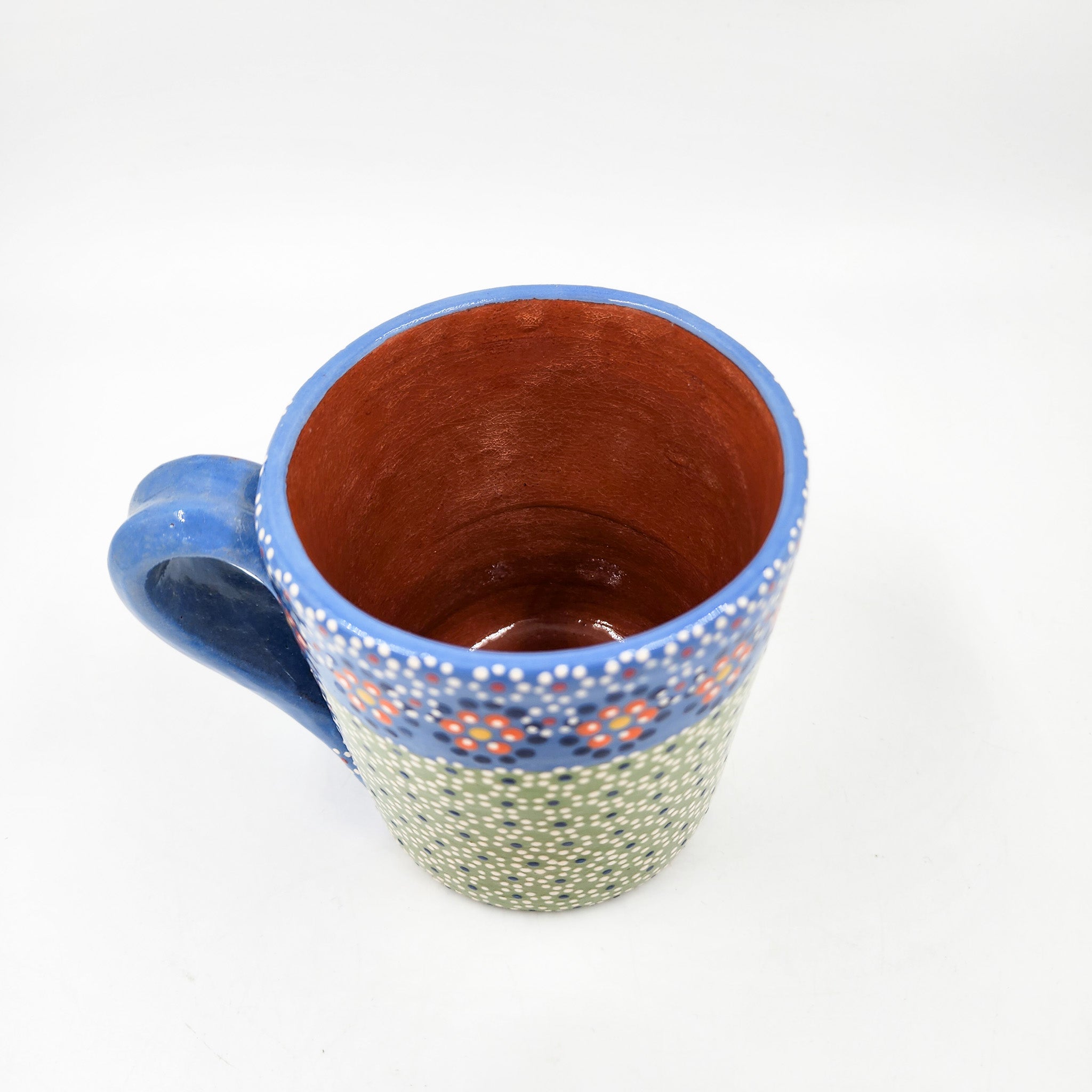 Taza de barro capulineado