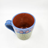 Taza de barro capulineado