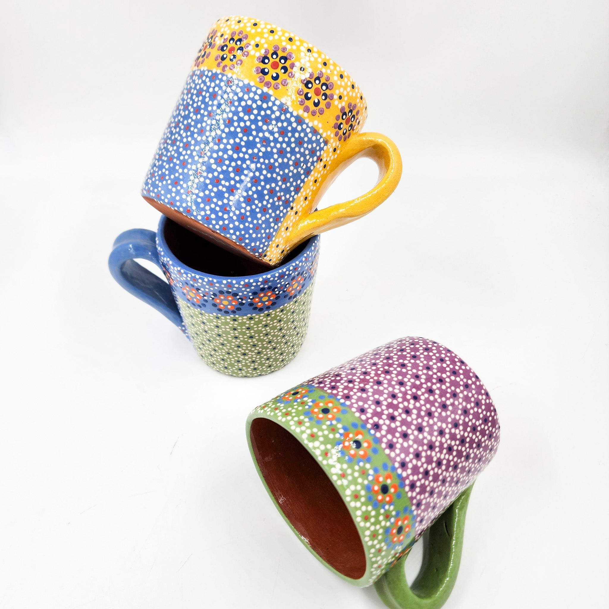 Taza de barro capulineado
