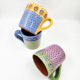 Taza de barro capulineado